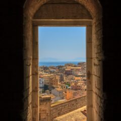 view of concrete buildings from window during daytime